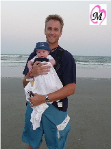 Daddy wearing infant in BabyBjorn
