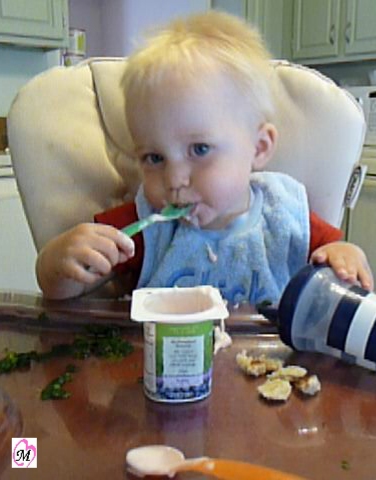 Baby Eating Yogurt with spoon